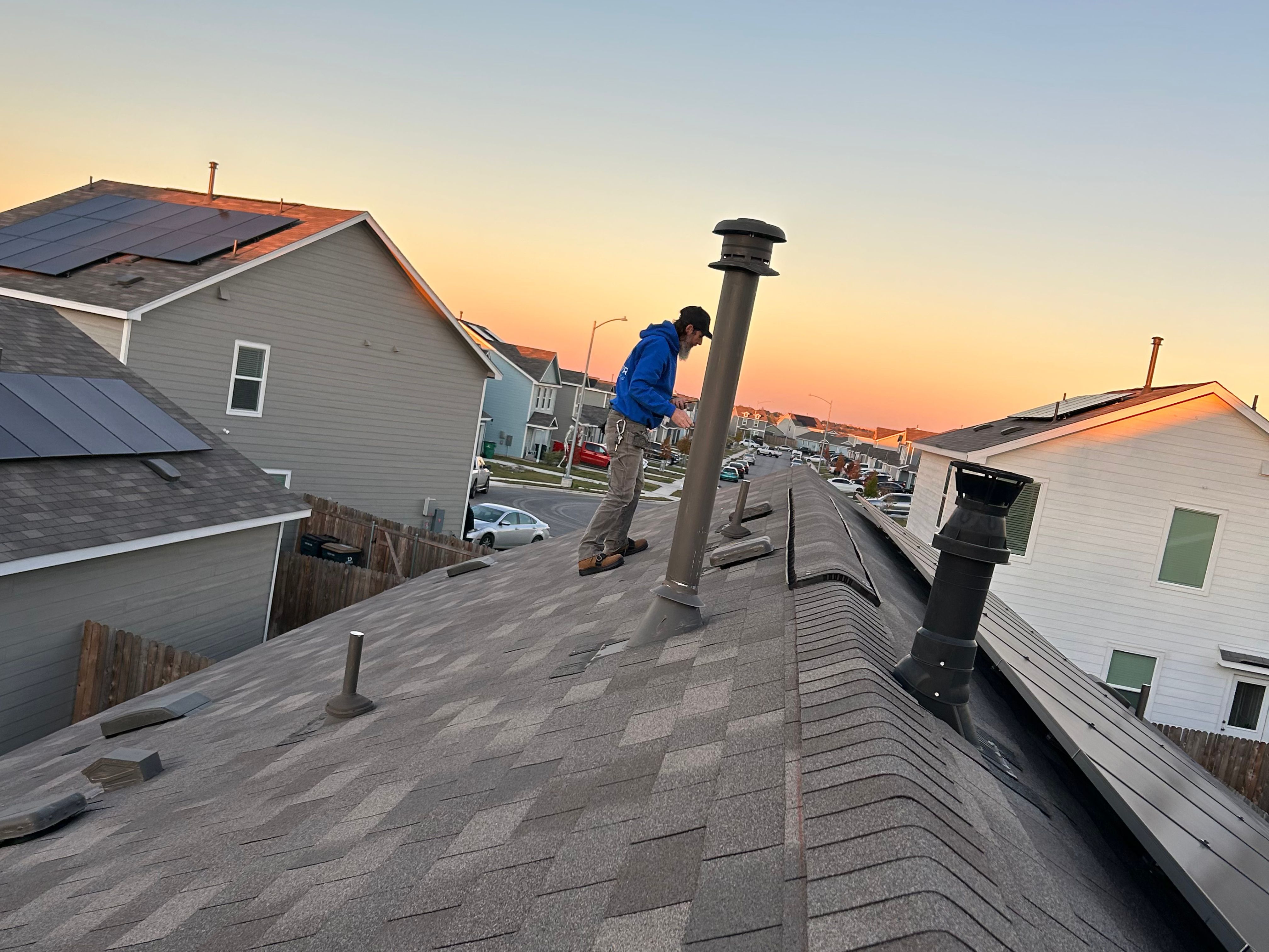 Roofer at sunset